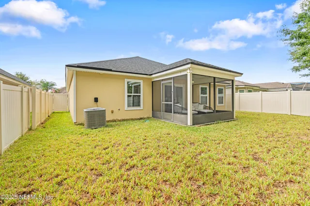 a view of a house with backyard porch and garden