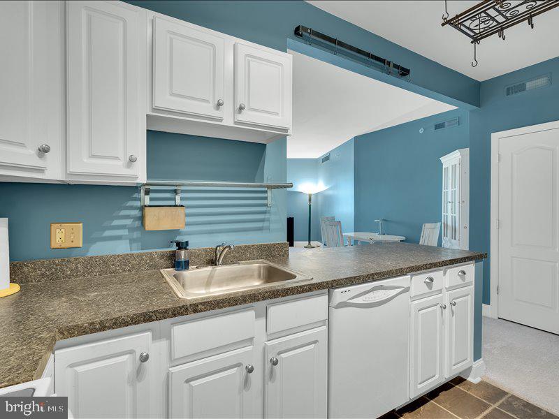 2 Canals End Road, Unit 305 Bristol, PA 19007 - Photo 14 of 22 a kitchen with granite countertop a sink and cabinets