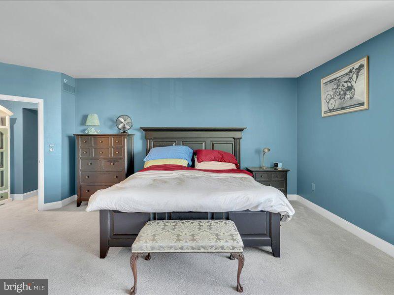2 Canals End Road, Unit 305 Bristol, PA 19007 - Photo 20 of 22 a bedroom with a bed and a table in it