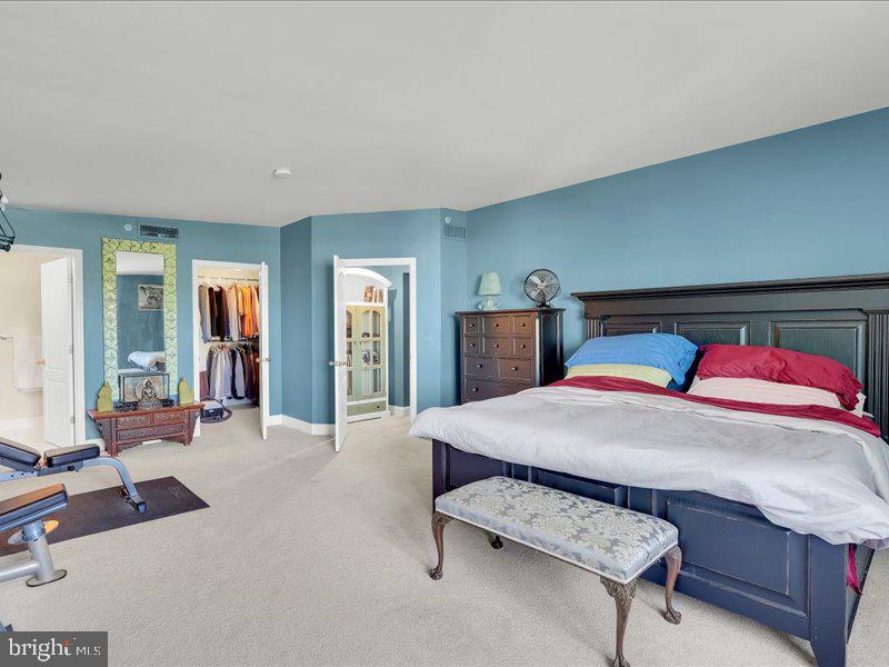 2 Canals End Road, Unit 305 Bristol, PA 19007 - Photo 21 of 22 a bedroom with a bed a table and chair