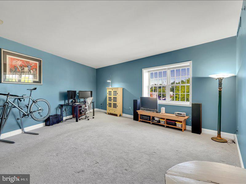 2 Canals End Road, Unit 305 Bristol, PA 19007 - Photo 8 of 22 a view of a livingroom with furniture and a flat screen tv