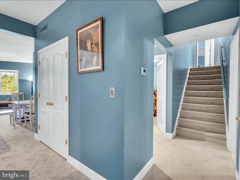 2 Canals End Road, Unit 305 Bristol, PA 19007 - Photo 9 of 22 a view of a hallway with paintings on the walls