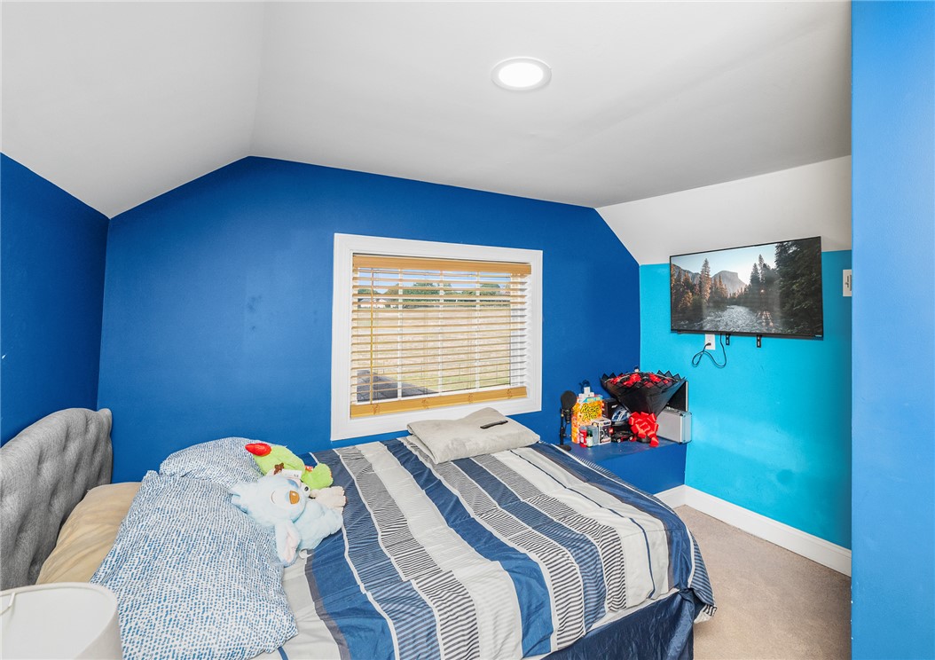 358 Finley Road Easley, SC 29642 - Photo 17 of 20 This cozy bedroom features plush carpeting and a bright window, creating a serene personal retreat.