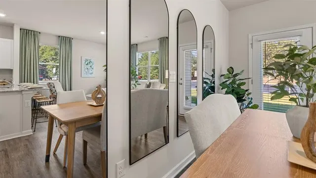 a view of a room with wooden floor and windows