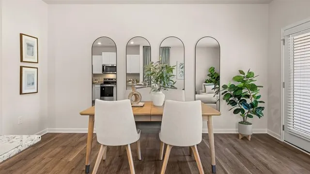 a view of a dining room with furniture window and wooden floor