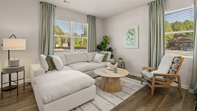 a living room with furniture and a large window