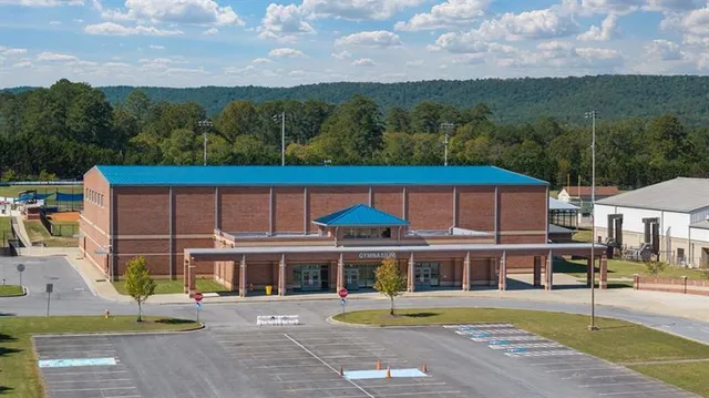 a view of a tennis court with a view of city