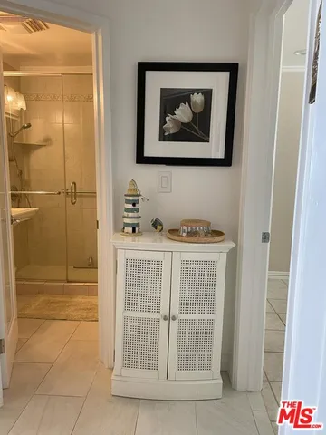 a bathroom with a tub and shower