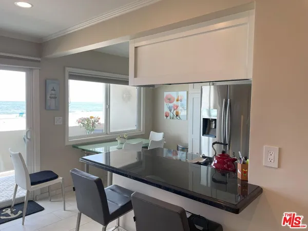 a dining room with table and chairs