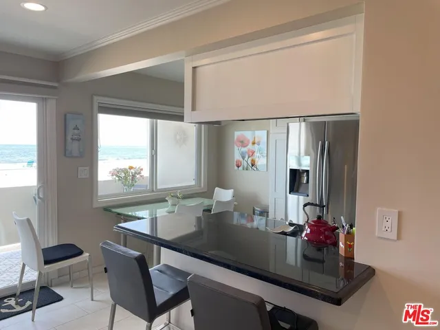 a dining room with table and chairs