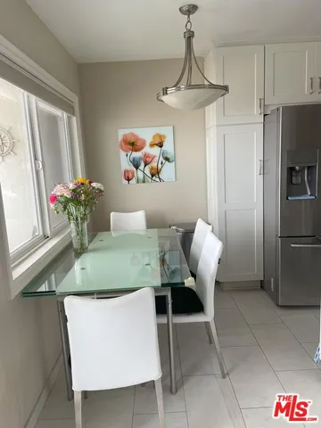 a view of kitchen island with furniture and stainless steel appliances