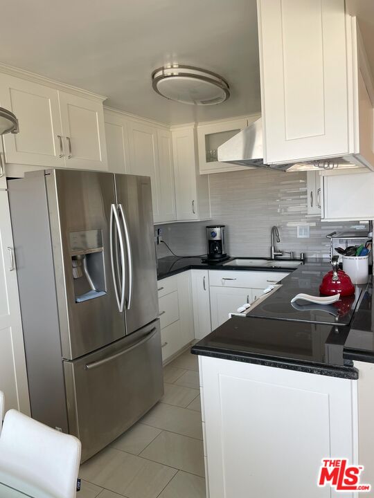 4975 Sandyland Road, Unit 212 Carpinteria, CA 93013 - Photo 9 of 18 a kitchen with stainless steel appliances granite countertop a refrigerator a sink a stove and dishwasher
