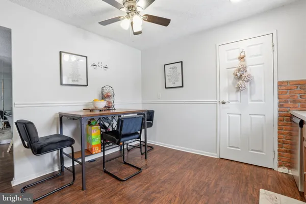 a workspace with furniture and wooden floor
