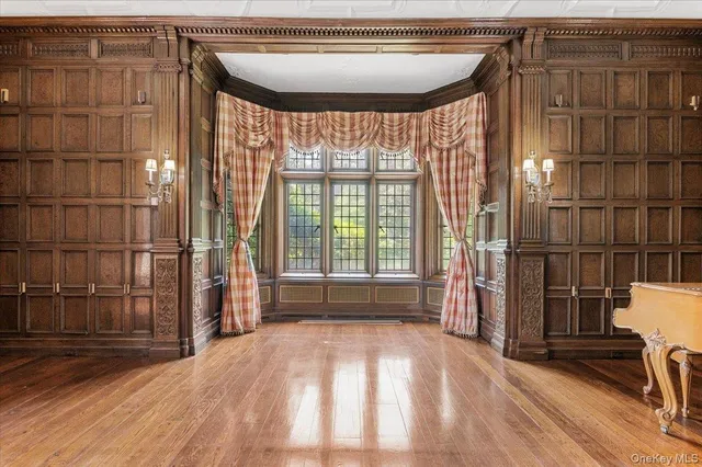 wooden floor in an empty room with a fireplace