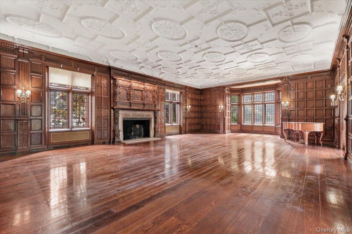 127 Horseshoe Road Mill Neck, NY 11765 - Photo 18 of 48 a view of an empty room with wooden floor and a window