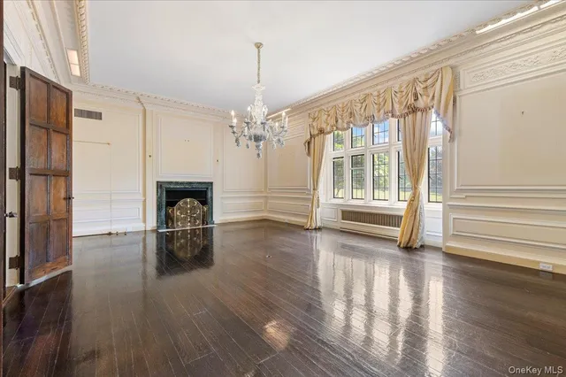 a view of a livingroom with furniture and a fireplace