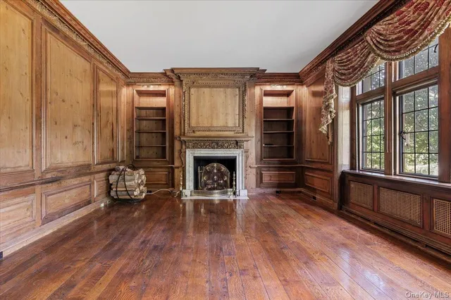 a view of an empty room with glass door