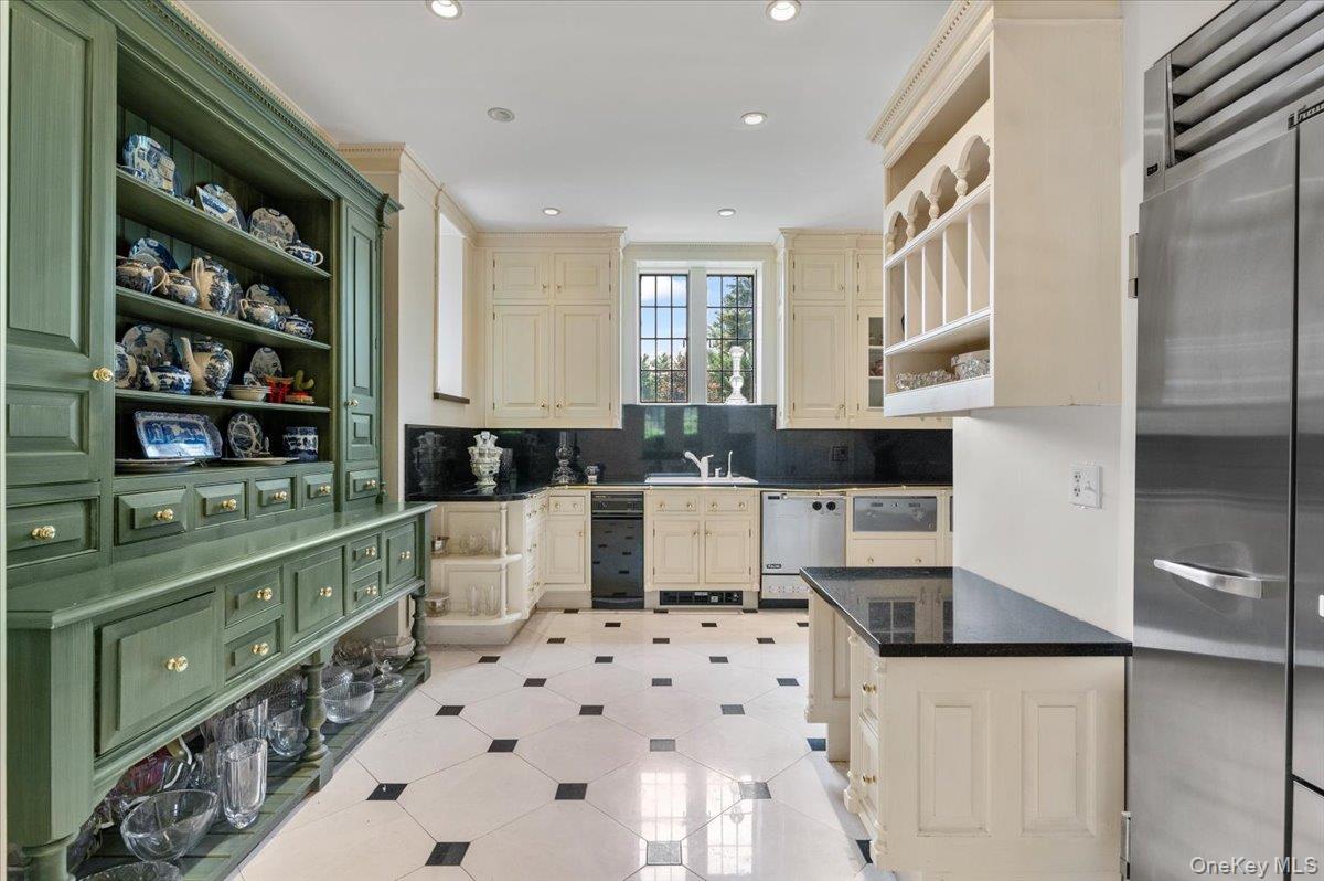 127 Horseshoe Road Mill Neck, NY 11765 - Photo 25 of 48 a kitchen with stainless steel appliances a white stove top oven a sink and a refrigerator
