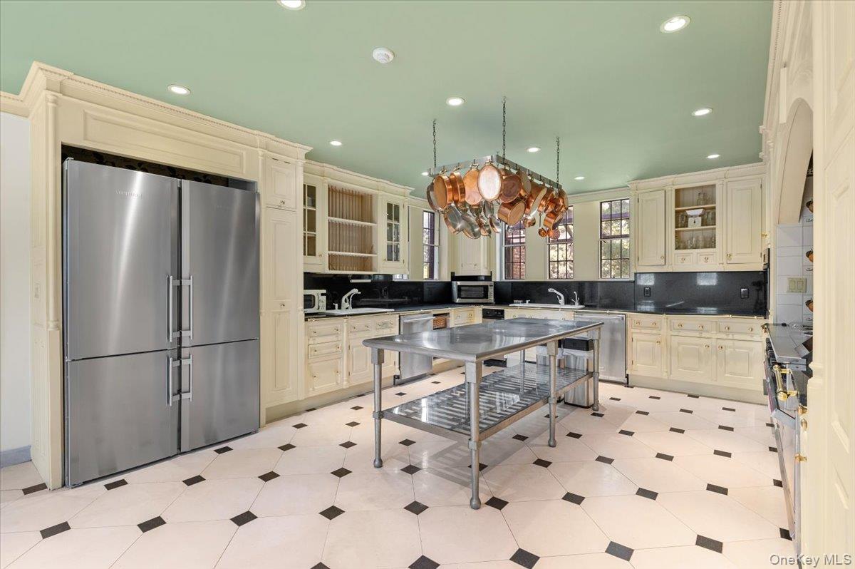 127 Horseshoe Road Mill Neck, NY 11765 - Photo 26 of 48 a kitchen with stainless steel appliances a refrigerator and a sink