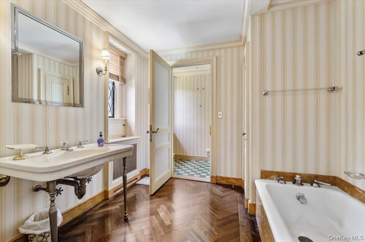 127 Horseshoe Road Mill Neck, NY 11765 - Photo 29 of 48 a bathroom with a tub sink and mirror