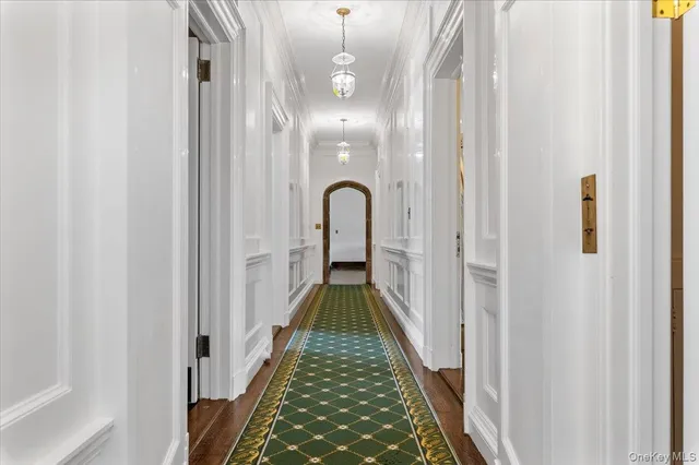 a view of an empty room with a fireplace and a window