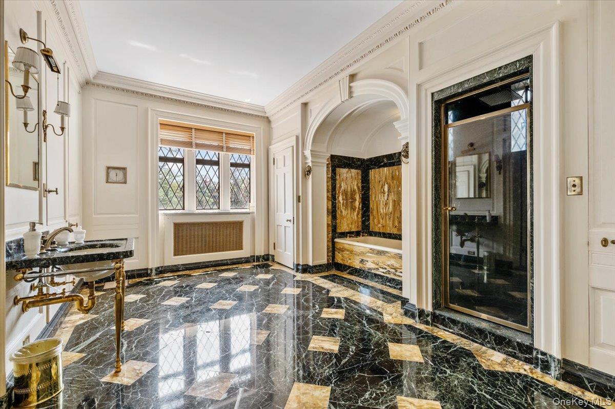 127 Horseshoe Road Mill Neck, NY 11765 - Photo 34 of 48 Bathroom with marble tiled floors, crown molding, and arched walkways