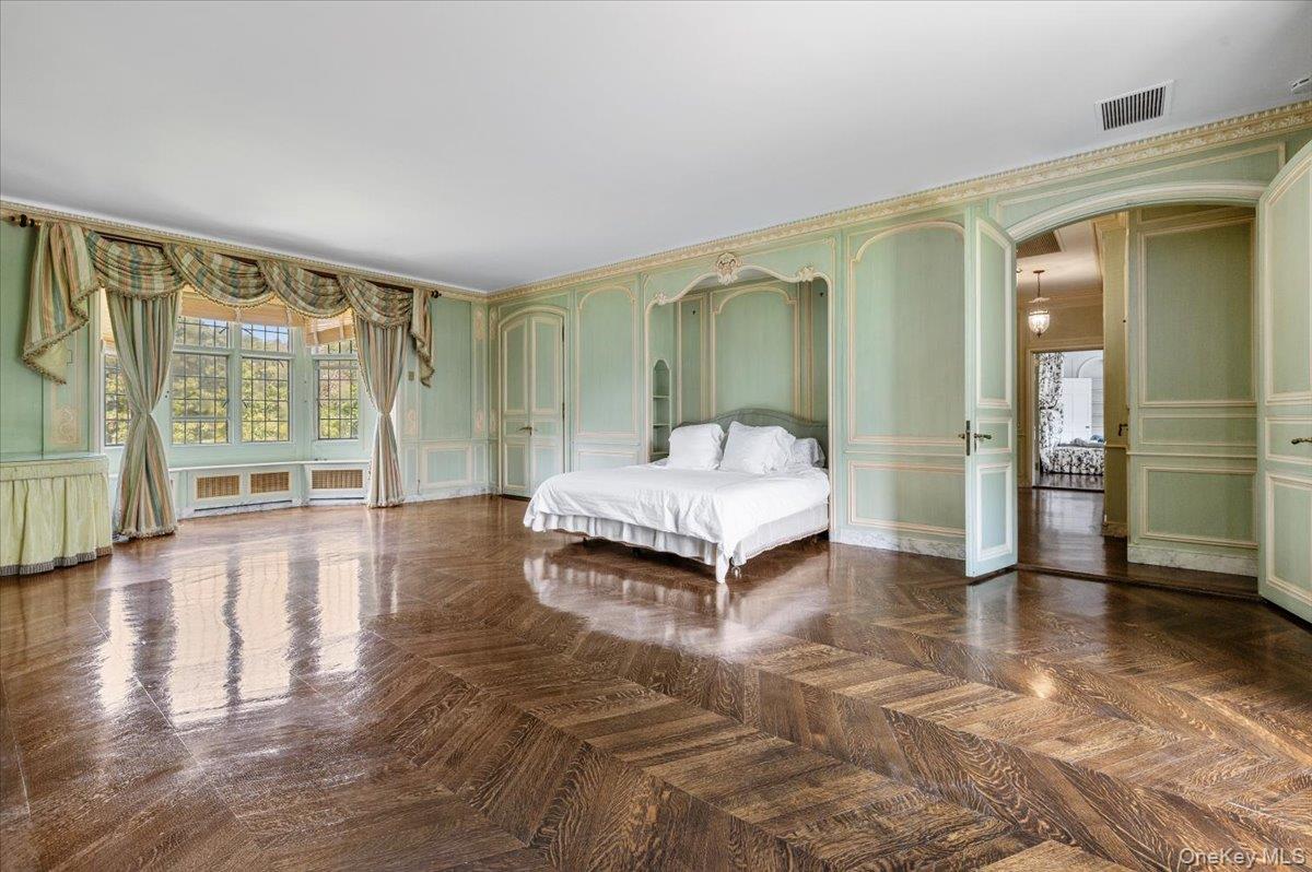 127 Horseshoe Road Mill Neck, NY 11765 - Photo 37 of 48 a spacious bedroom with a balcony and large window