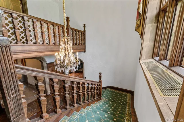 a spacious bedroom with a balcony a bed and wooden floor