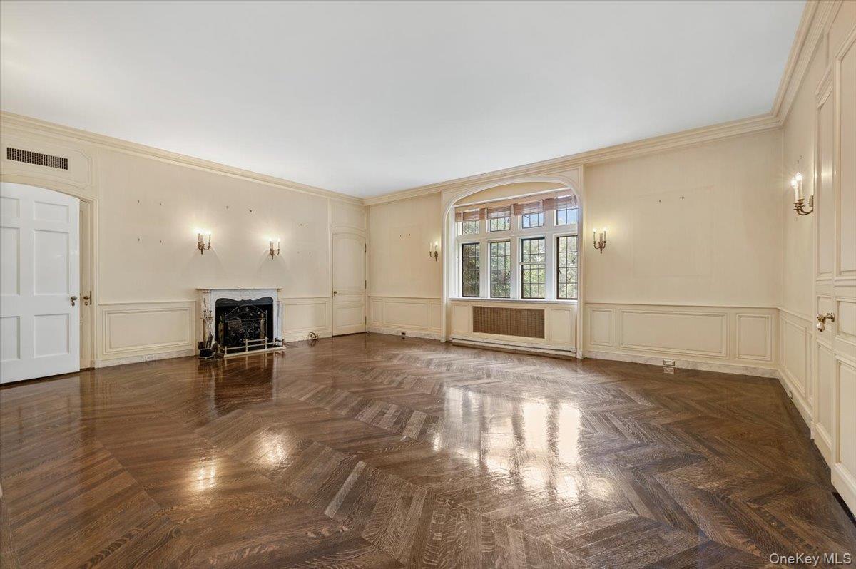 127 Horseshoe Road Mill Neck, NY 11765 - Photo 43 of 48 a view of empty room with wooden floor and fireplace