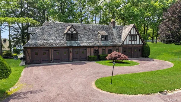 a house with lots of trees in the background