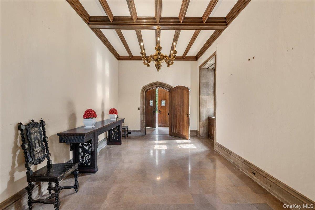 127 Horseshoe Road Mill Neck, NY 11765 - Photo 7 of 48 a view of a hallway with a yellow plant