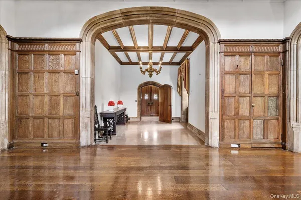 a living room with a fireplace furniture and a large window