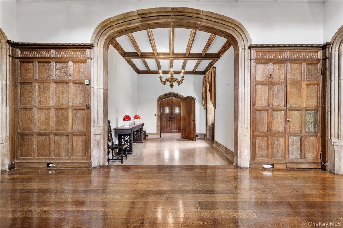 127 Horseshoe Road Mill Neck, NY 11765 - Photo 8 of 48 a living room with a fireplace furniture and a large window