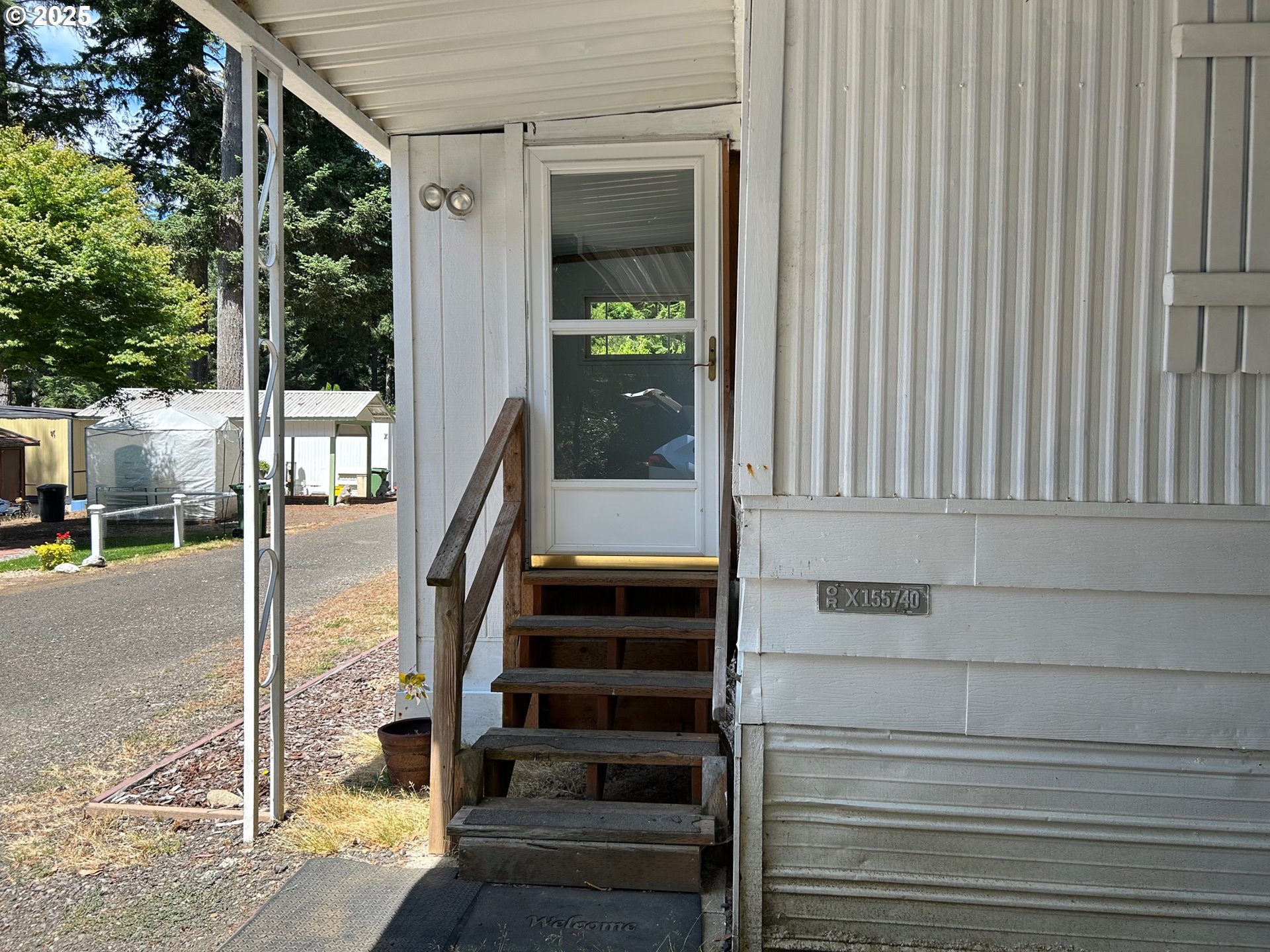 89510 Highway 101, Unit 23 Florence, OR 97439 - Photo 22 of 28 a view of a entryway front of house