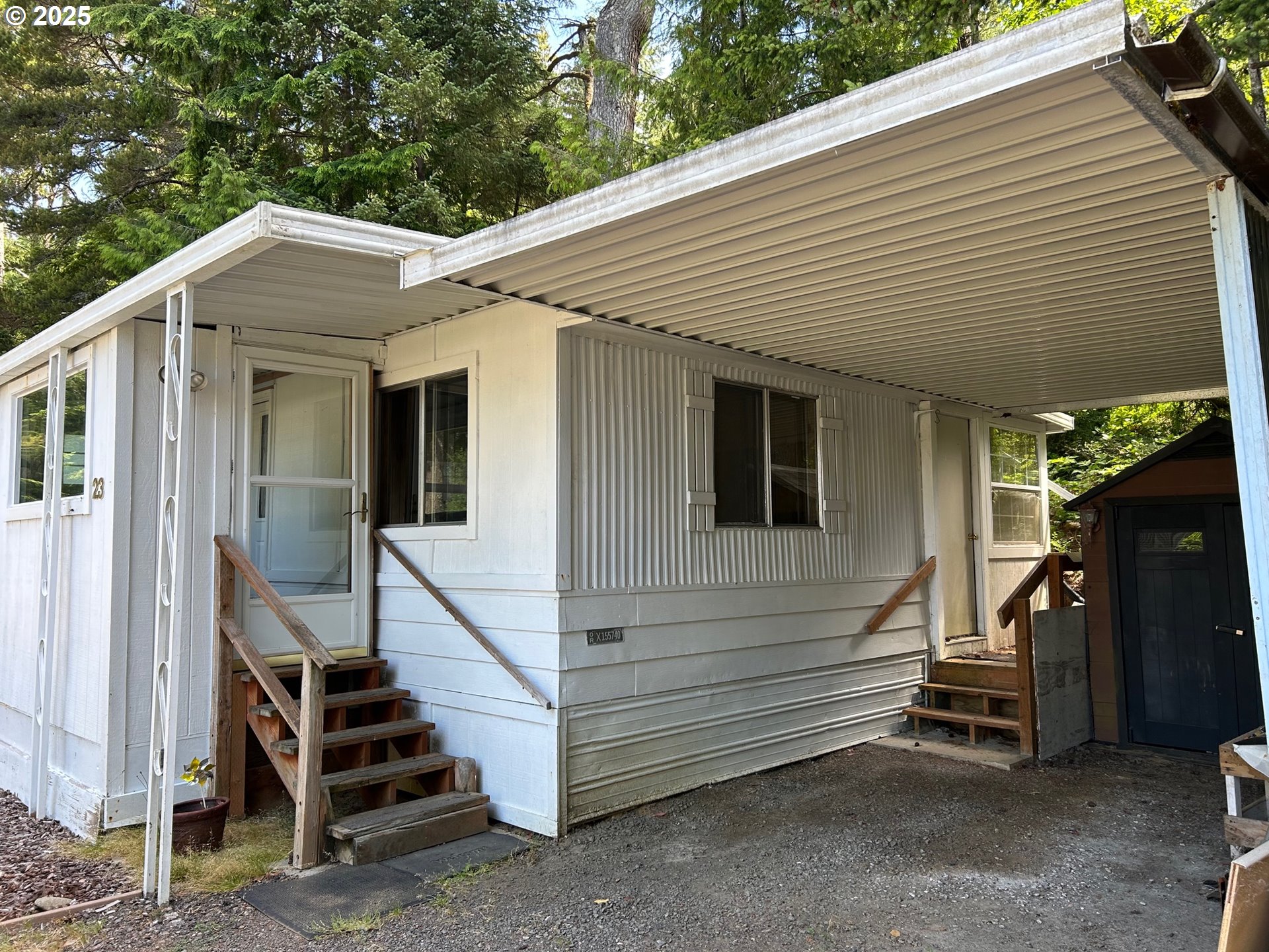 89510 Highway 101, Unit 23 Florence, OR 97439 - Photo 4 of 28 a view of a house with backyard and stairs