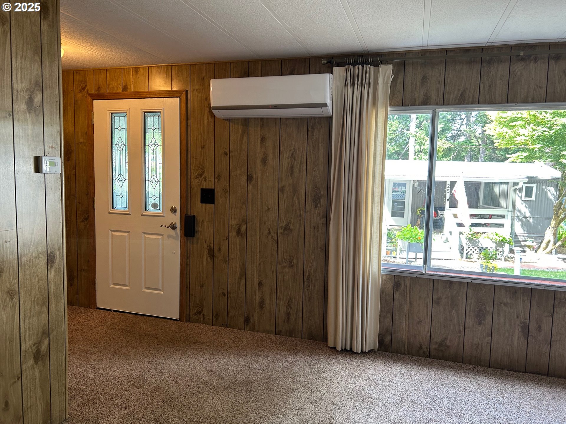 89510 Highway 101, Unit 23 Florence, OR 97439 - Photo 10 of 28 wooden floor and windows in a room