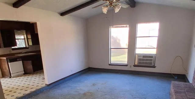 a view of an empty room with a window