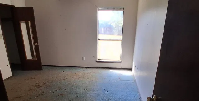 an empty room with windows
