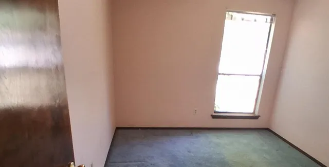 a view of a room with wooden walls