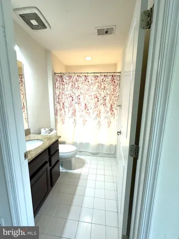 a view of an empty room with windows