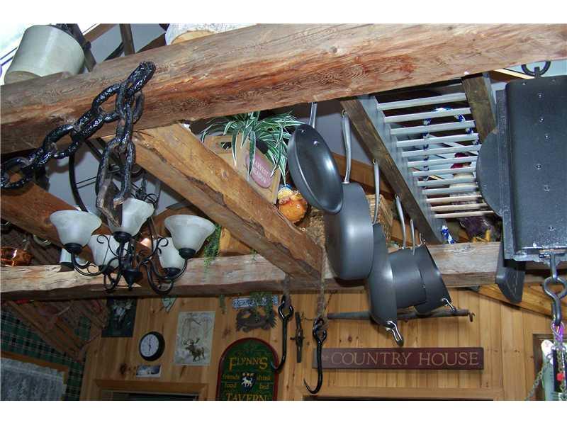 373 Smith Road Corinna, ME 04928 - Photo 5 of 35 Kitchen. Wooden beams and pot rack...