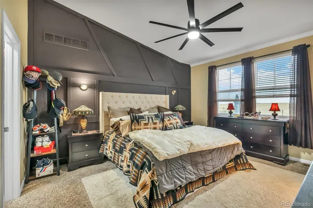 a bedroom with a bed and a mirror