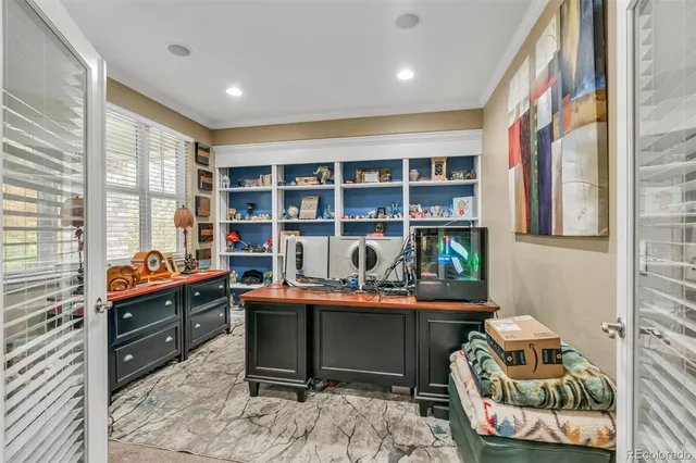 a room with furniture a rug and a window