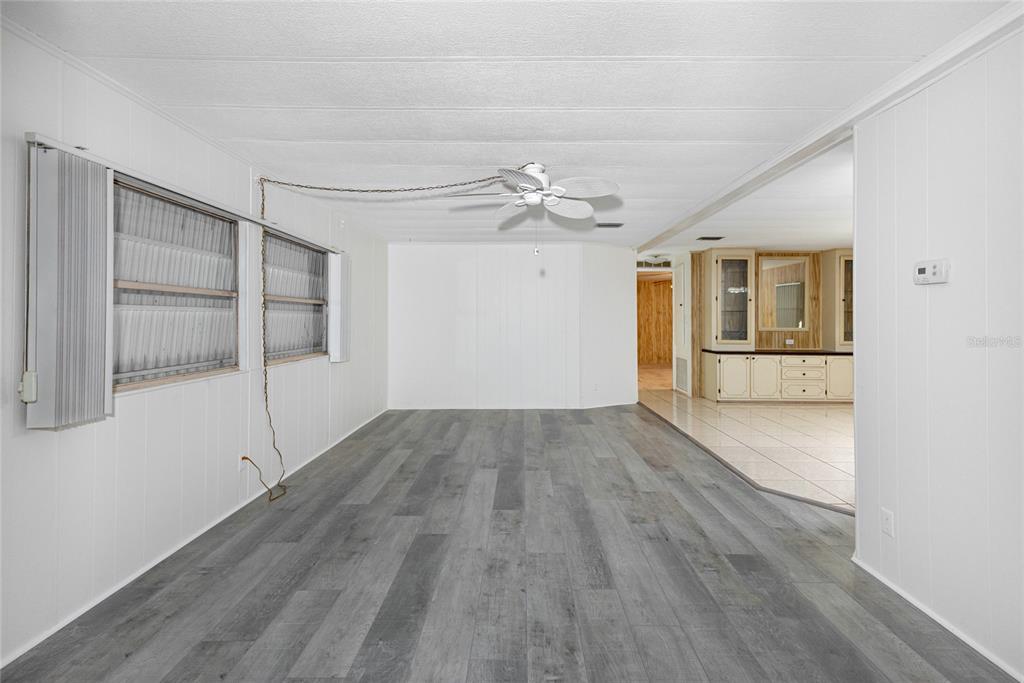 2542 Longpine Lane St. Cloud, FL 34772 - Photo 14 of 35 wooden floor in an empty room with a window