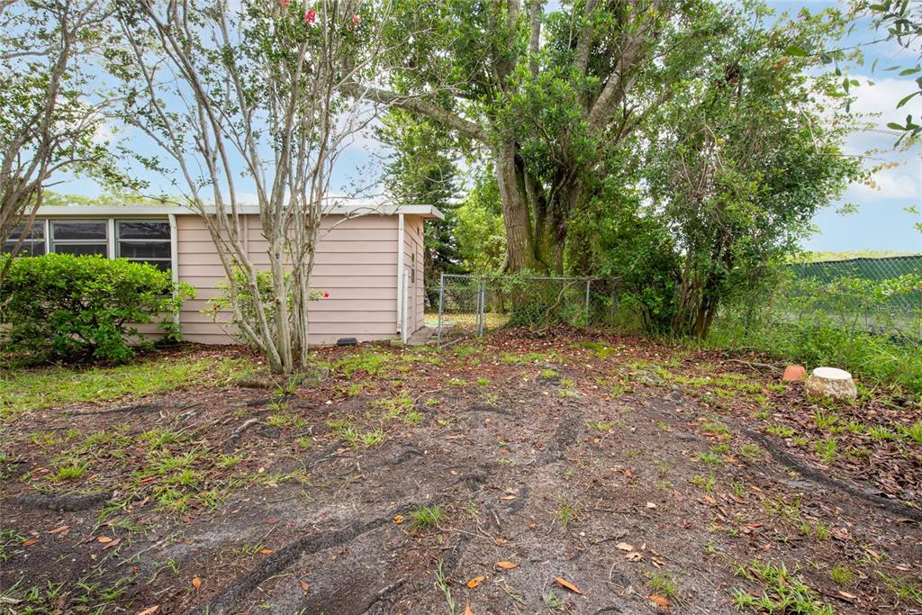 2542 Longpine Lane St. Cloud, FL 34772 - Photo 25 of 35 a view of a house with a yard