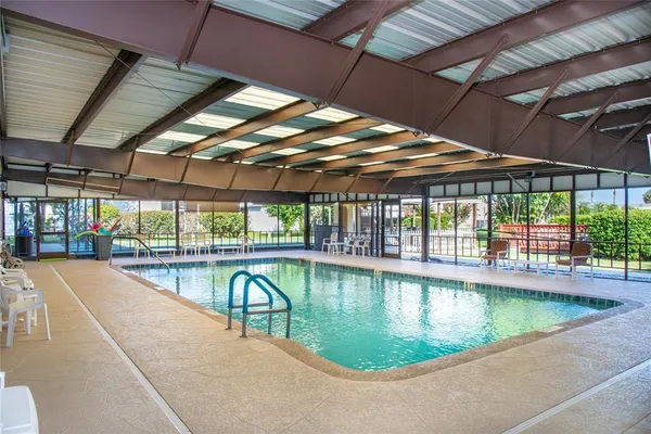 a view of a swimming pool with a porch