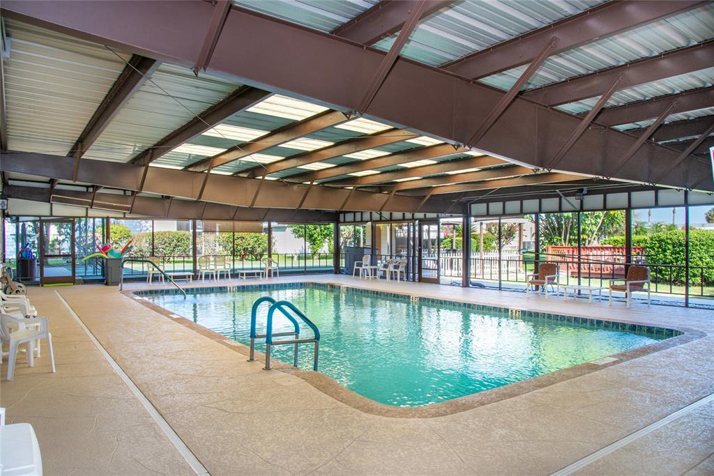 2542 Longpine Lane St. Cloud, FL 34772 - Photo 31 of 35 a view of a swimming pool with a porch