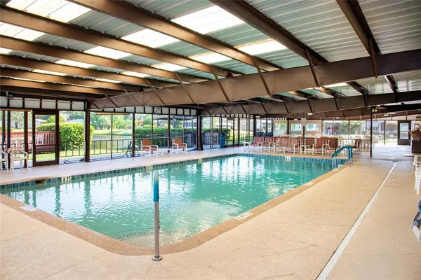 a view of a swimming pool with a patio