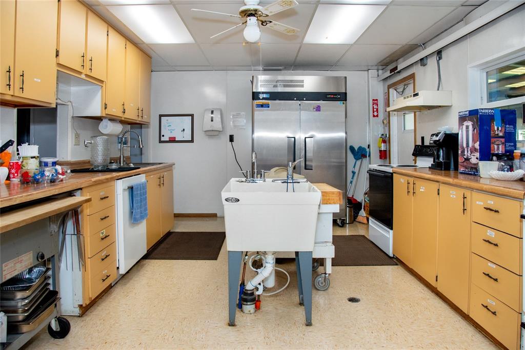 2542 Longpine Lane St. Cloud, FL 34772 - Photo 34 of 35 a kitchen with granite countertop a sink appliances cabinets and furniture
