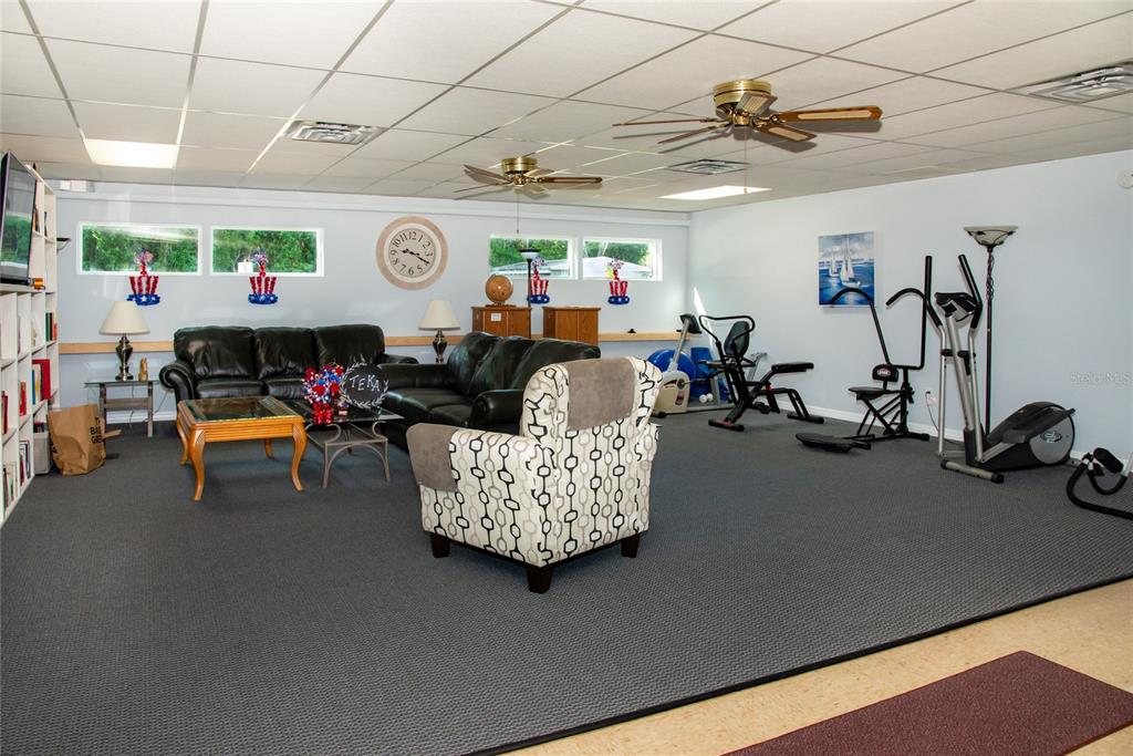 2542 Longpine Lane St. Cloud, FL 34772 - Photo 35 of 35 a living room with furniture and a gym equipment